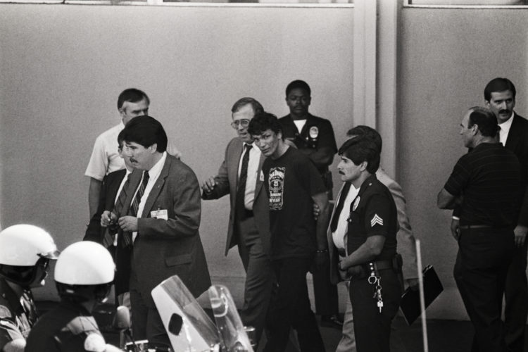 (Original Caption) 8/31/85-Los Angeles, California: Richard Ramirez, the man police have arrested as the alleged Night Stalker is surrounded by pol...
