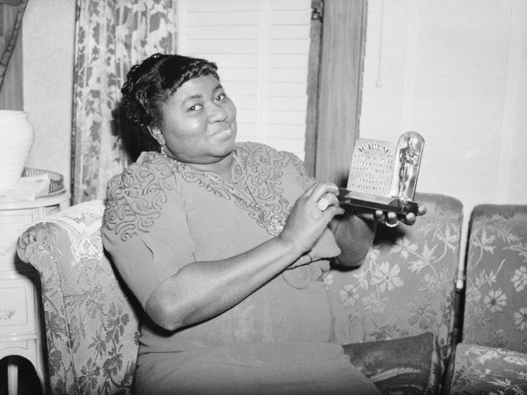 (Original Caption) 3/2/1940- Los Angeles, CA: Actress Hattie Mc Daniel is shown with the statuette she received for her portrayal in "Gone With The...