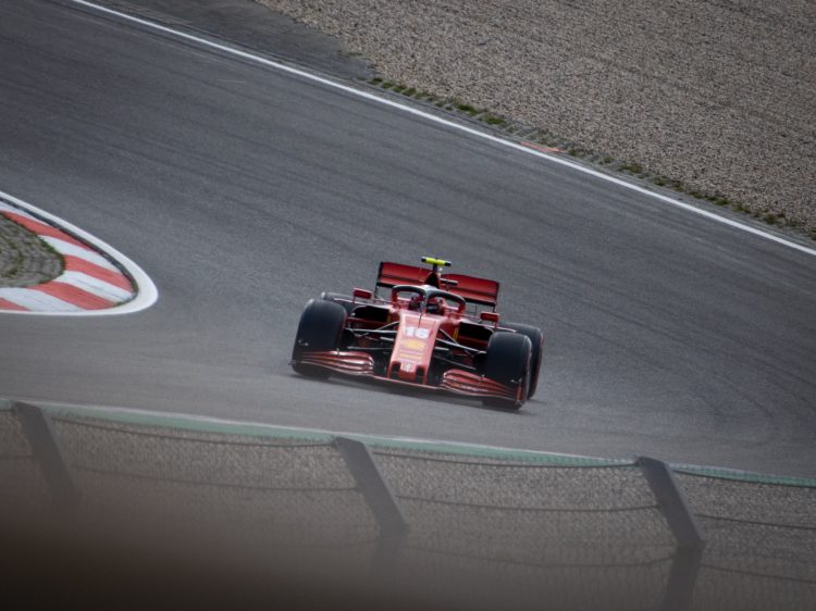red and black formula 1 on road