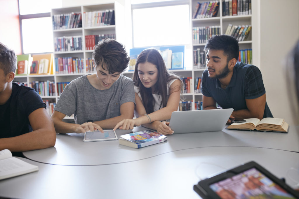College students working in group with technology
