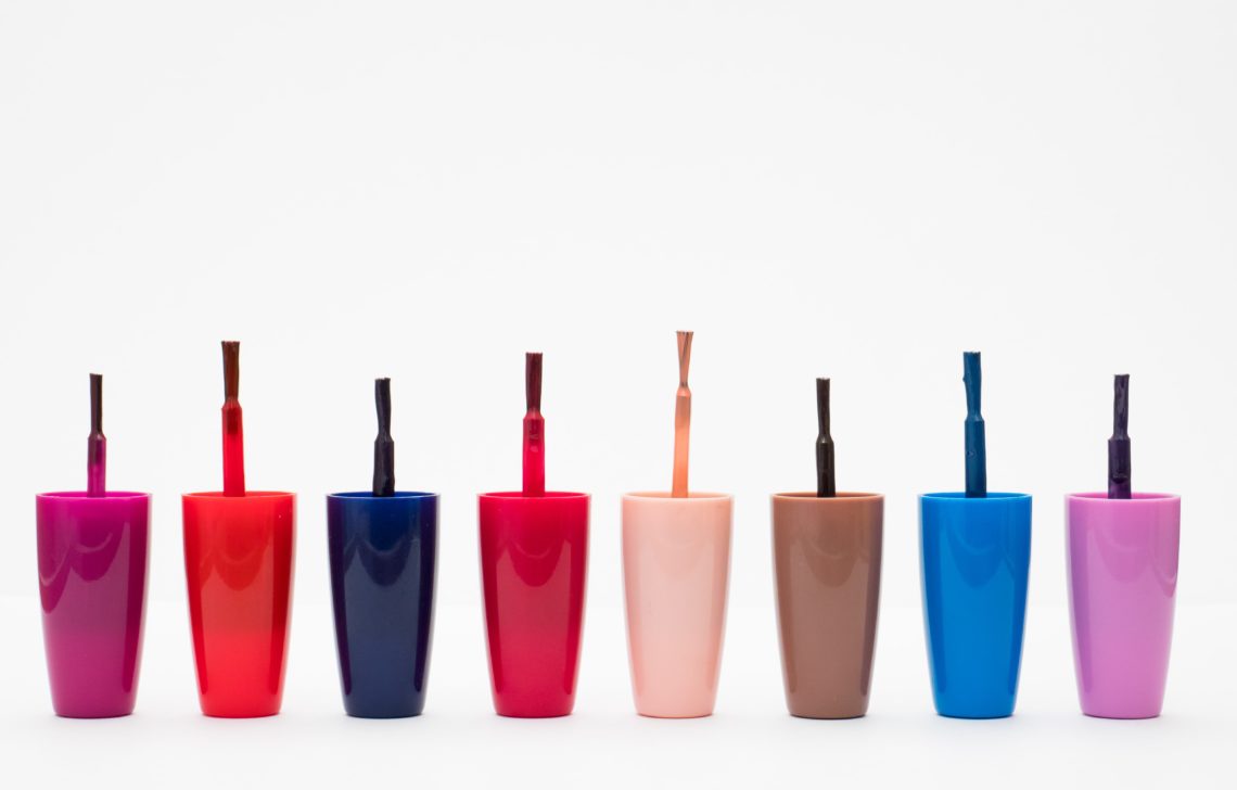 eight assorted color glass bottles