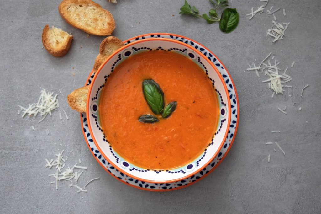 brown soup on white and blue ceramic bowl