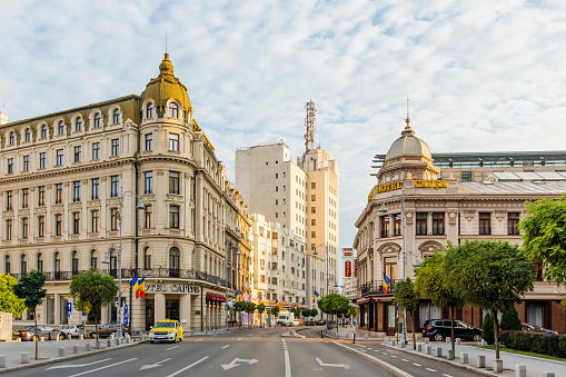 Bucharest street with historic buildings early in the morning, Bucharest, Romania