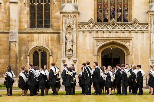 Cambridge University students in their gowns, England