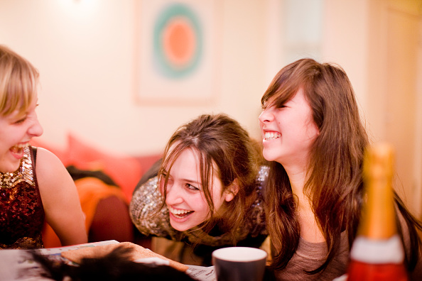 UK - London - Young adults enjoying an evening at home