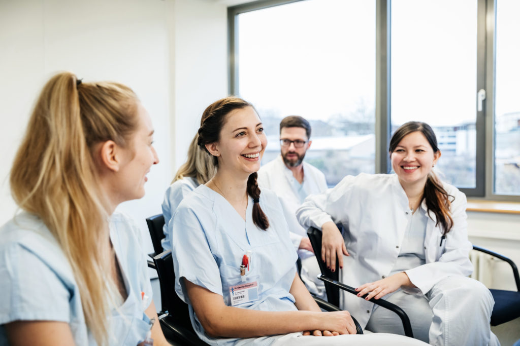 Medical Students Laughing During Seminar