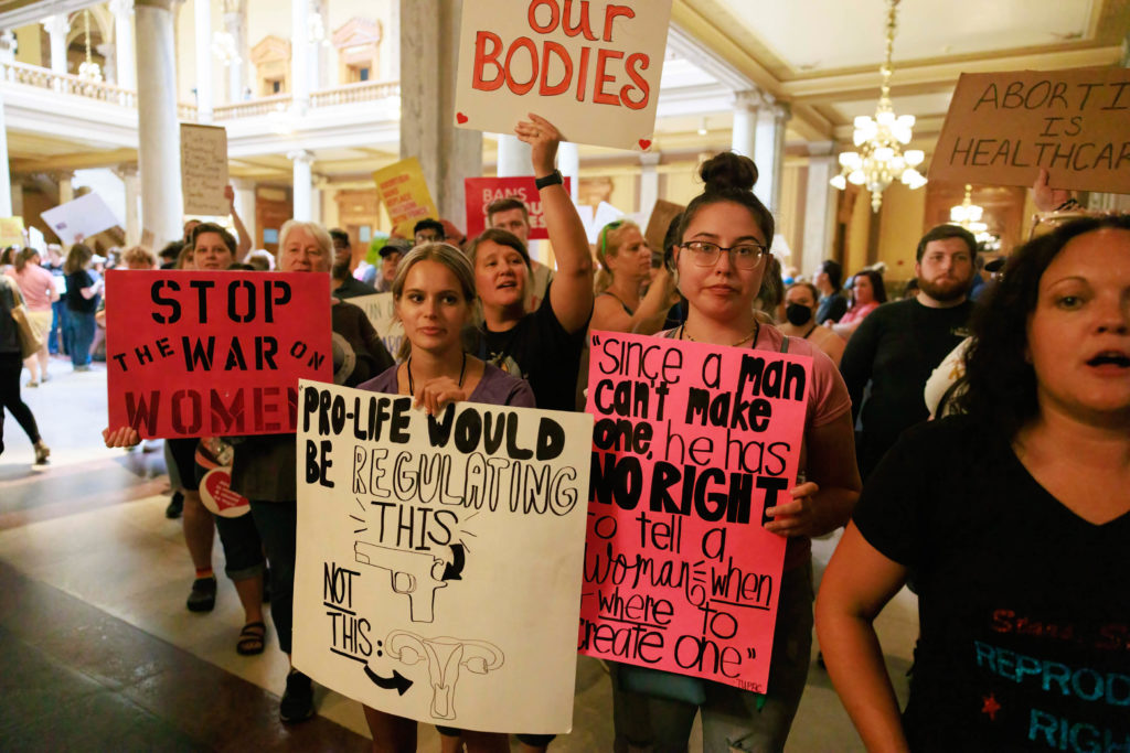 Abortion-rights protesters demonstrate inside the Indiana