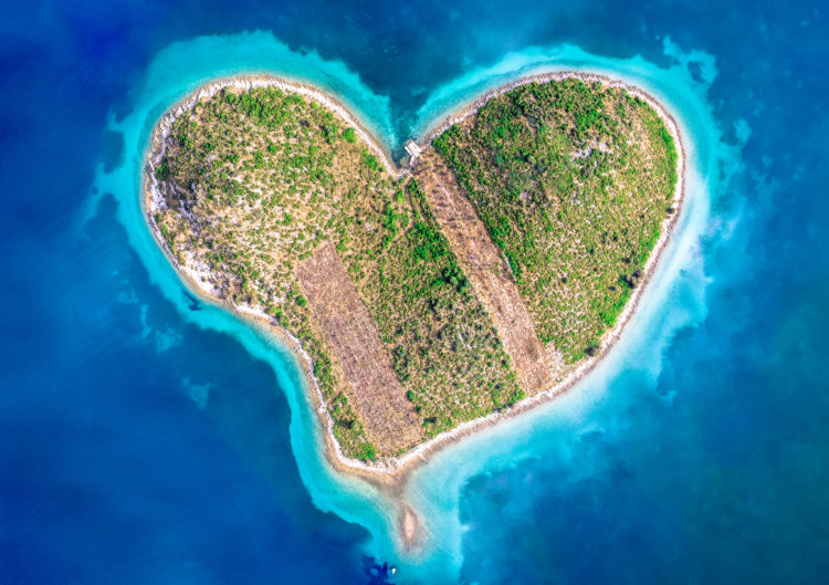 Aerial view of Galesnjak (Island of Love), a natural heart-shaped island, situated in Adriatic Sea, in Zadar region of Croatia.