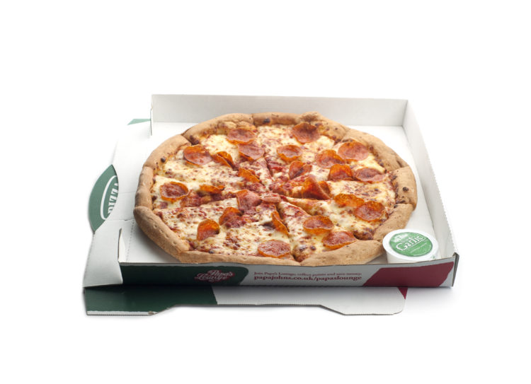 London, England-March 30, 2011. Papa John's pepperoni pizza in delivery box on white background.  Papa Johns is a pizza delivery chain that was sta...