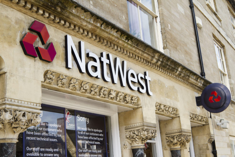 "Oundle, Northamptonshire, England - July 4th 2012.The Natwest logo outside one of their bank branches in the village of Oundle. The largest bank i...