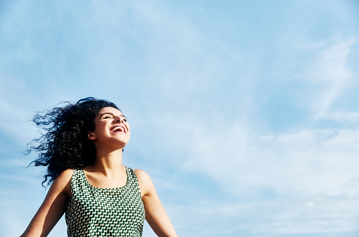 Smiling woman with sky
