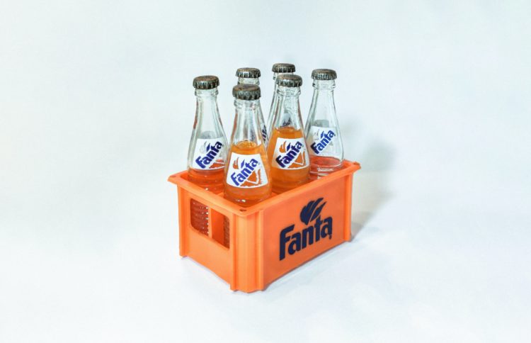 2 coca cola bottles on white surface