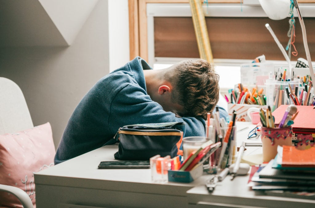 stressed student during home schooling pandemic alert