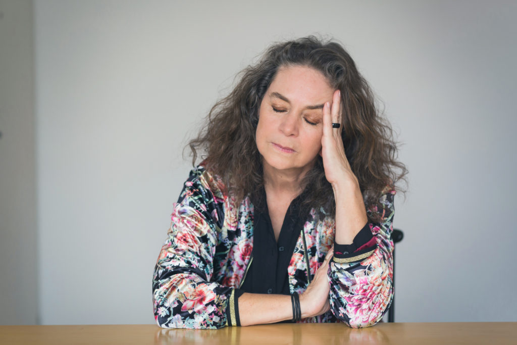 Depressed or unwell pretty middle-aged woman