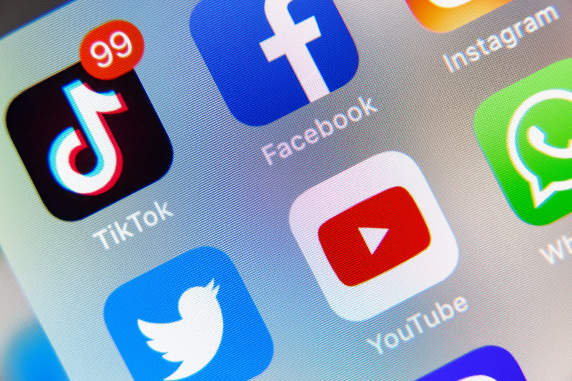 TikTok and Facebook, YouTube application  on screen Apple iPhone XR
