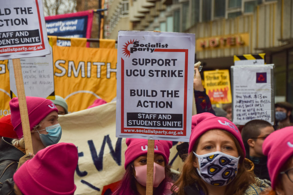 A protester holds a 'Support UCU Strike' placard during the