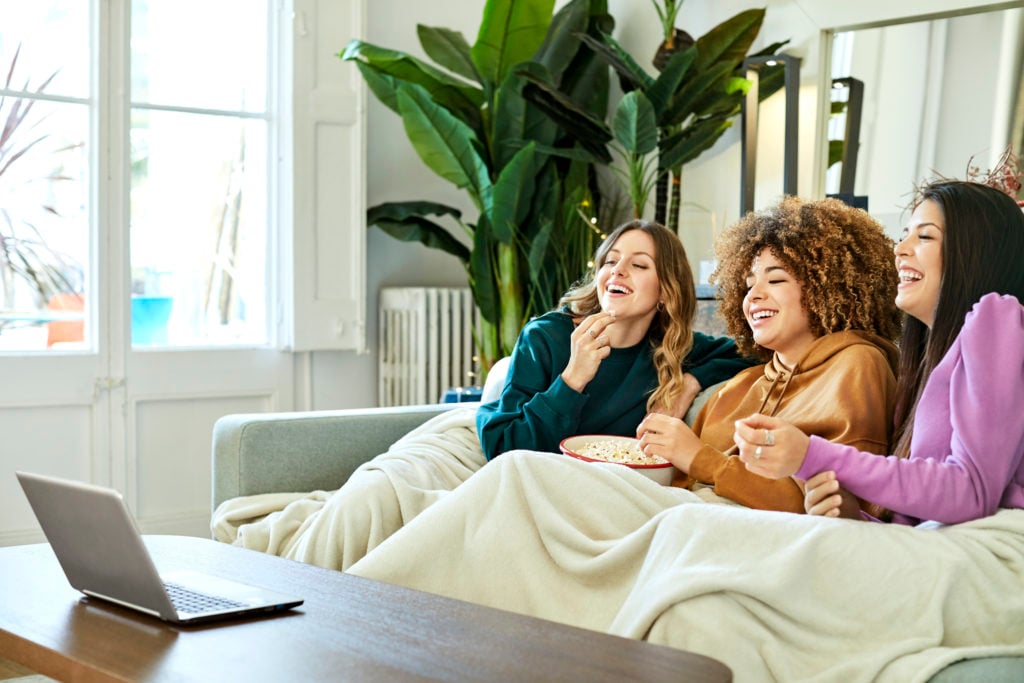 Happy friends Watching Netflix Movie at Home.