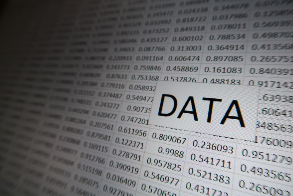 The word "DATA" against a Grid of Random Numbers on a Digital Display.