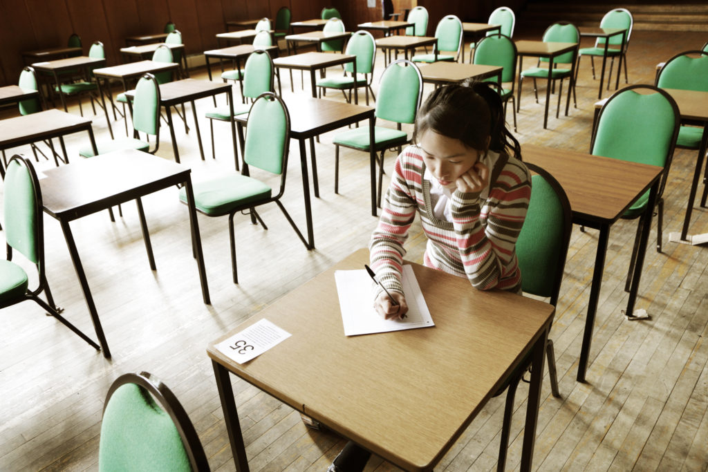 Girl sat alone in exam room