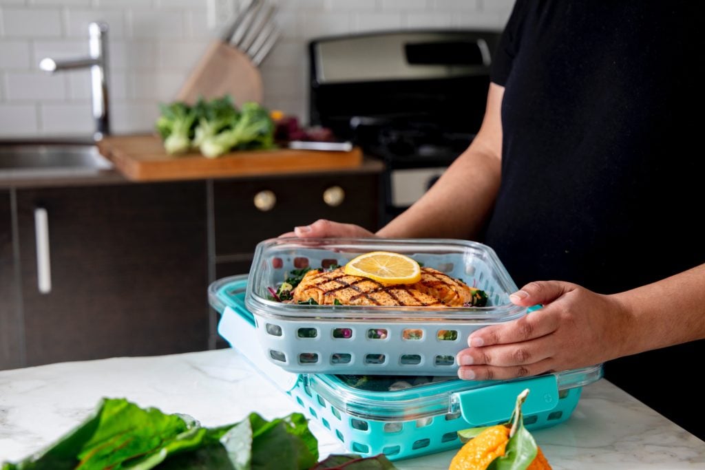 person holding tray with food