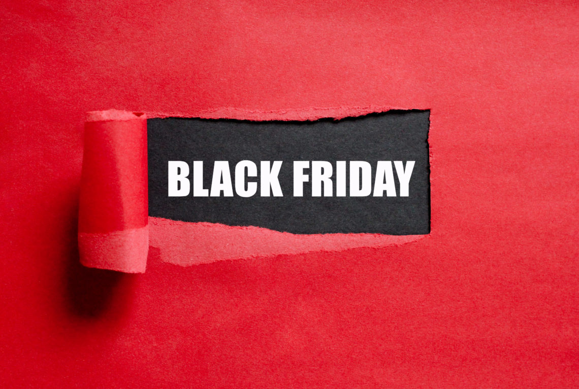 Black Friday text. Torn red paper with copy space for text.