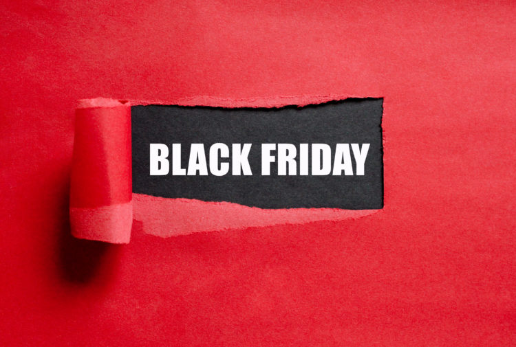Black Friday text. Torn red paper with copy space for text.