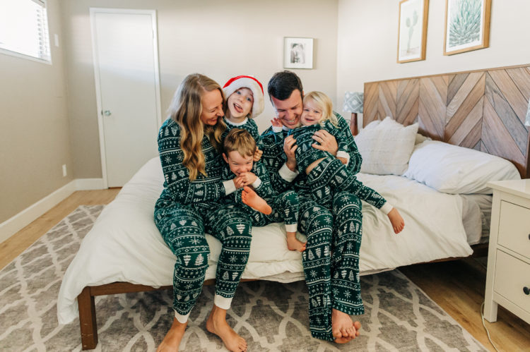 Family in matching Christmas pajamas courtesy of Getty Images