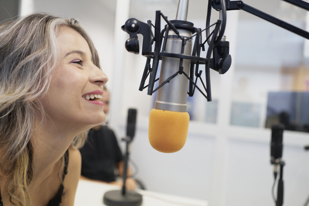Woman hosting a radio show.