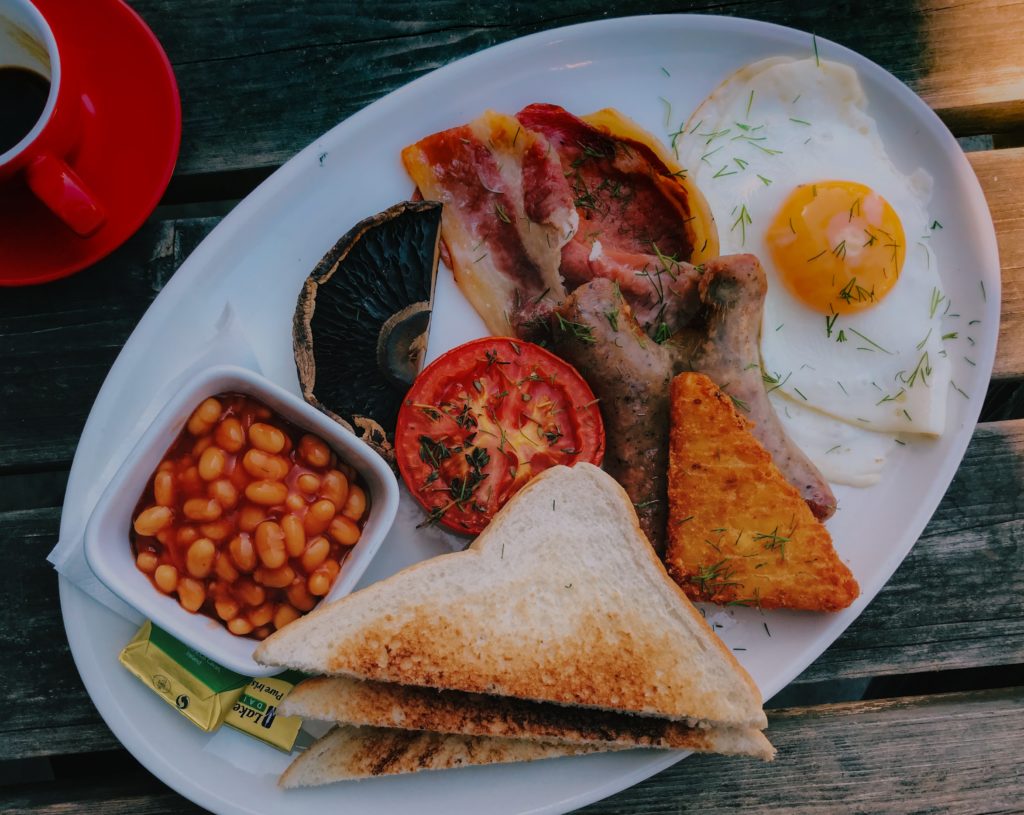 sliced meat with egg on white ceramic plate