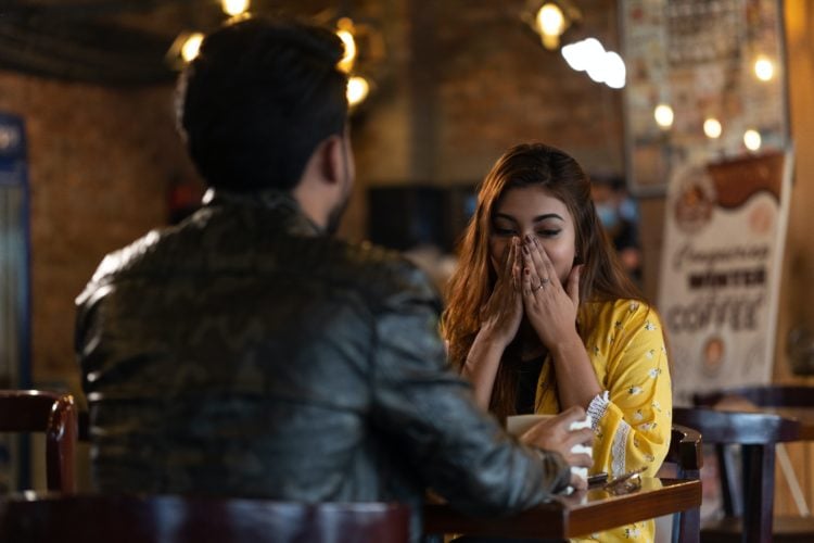 man and woman sitting at the table