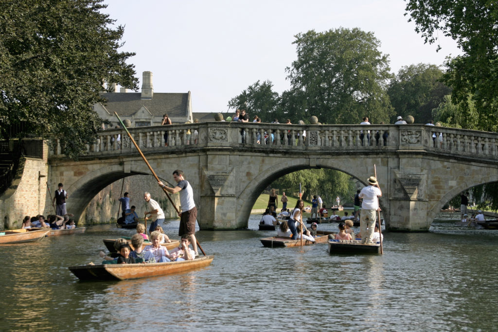 UK, England, Cambridge, people punting on River Cam near Kings College