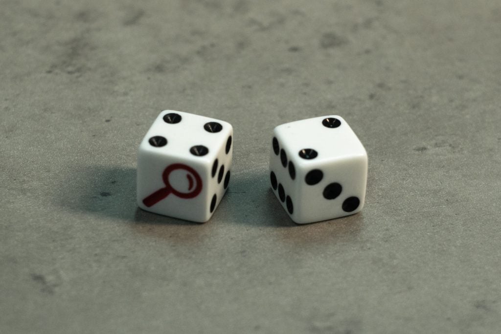 A set of dice from the board game Cluedo of Hasbro