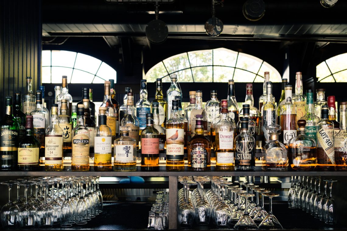 assorted liquor bottles on table