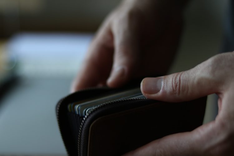 person opening wallet