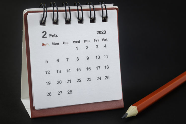 Calendar desk showing February 2 2023 with a red pencil beside it. Courtesy of Getty.