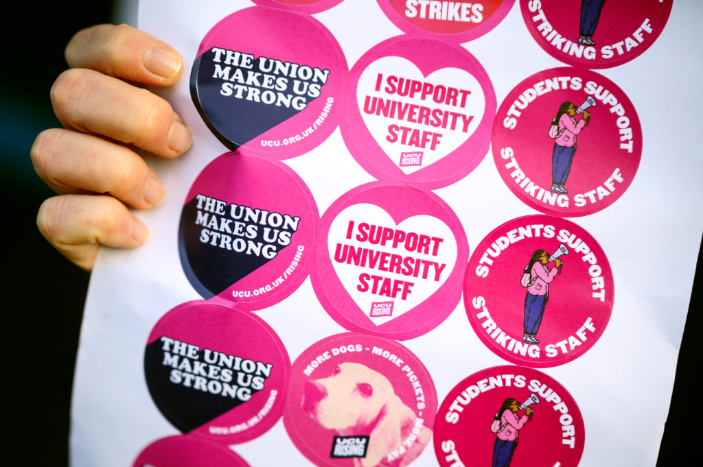 UCU strike stickets held closer to the camera.