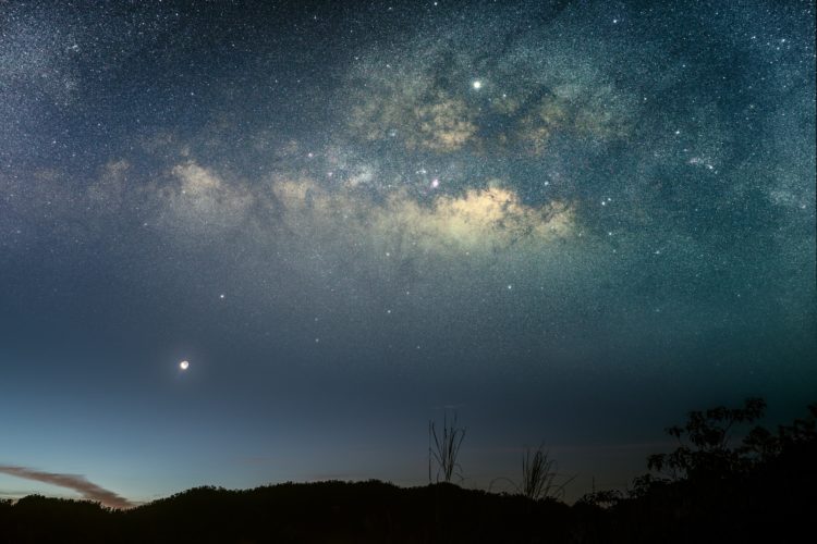 silhouette photo of mountain under starry night