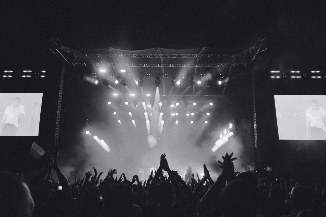 black and white photo of crowd at a concert