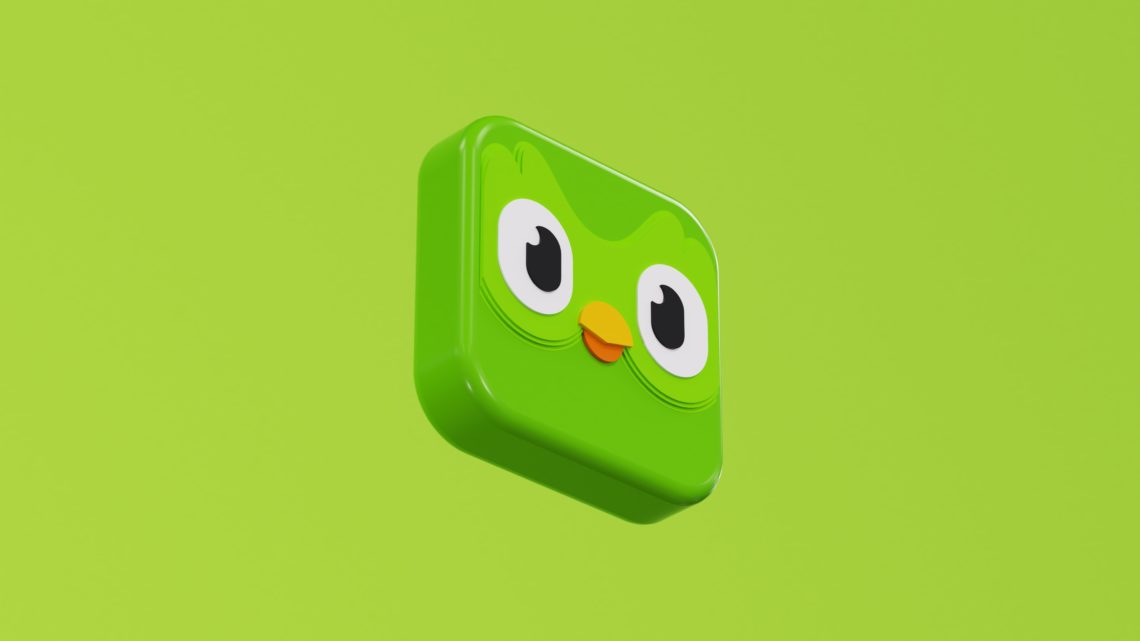 a green square object with eyes and a nose