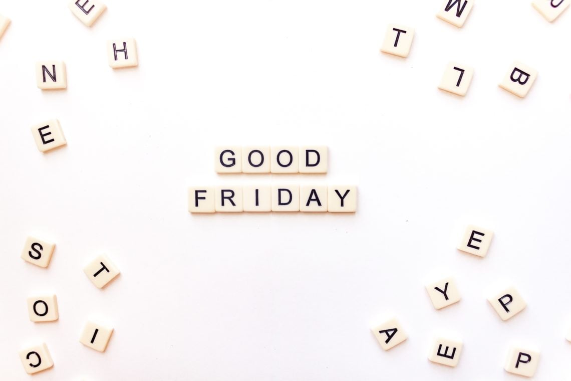 good friday written in scrabble tiles with mix of letters surrounding it