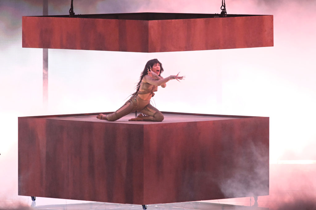 Sweden's Loreen perorming sat in between two layers of wood for eurovision semi final