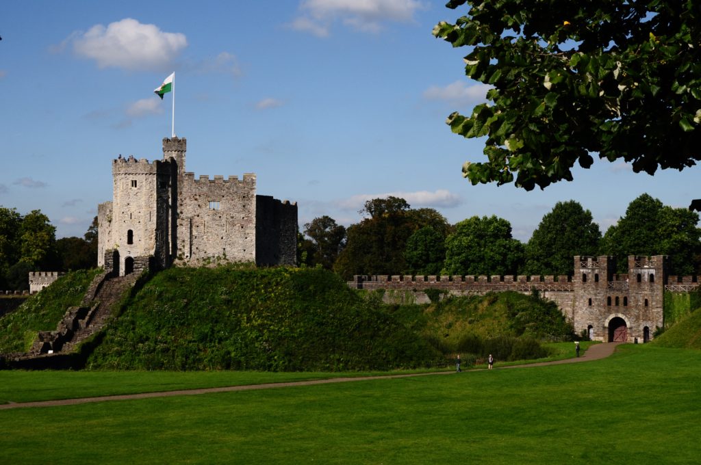 Cardiff Castle with flag hoisted on sunny day